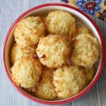 Keto coconut macaroons are served in a bowl with a napkin.