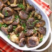 Shiitake mushrooms are served in a white baking dish.