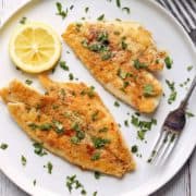 Sole meunière is served on a plate with a fork.