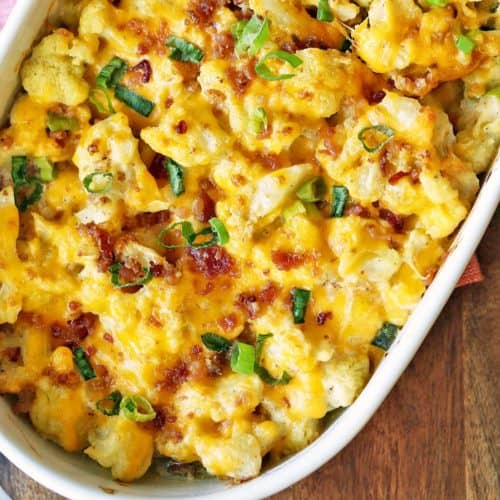 Cauliflower casserole is served in a white baking dish.