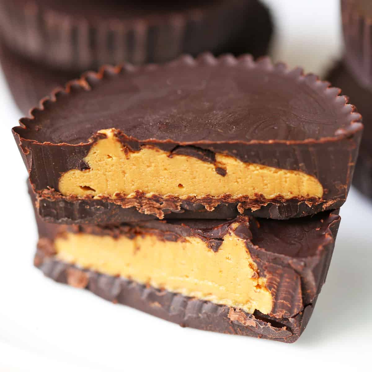Keto peanut butter cups are served on a white plate.
