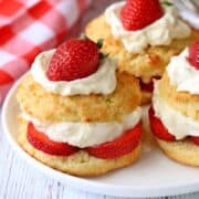 Keto strawberry shortcake is served on a white plate.