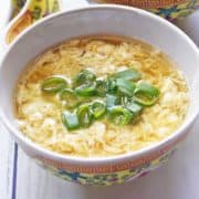 Egg drop soup is served in a Chinese-style bowl.