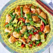 Chicken stir-fry is served on a Chinese-style plate.