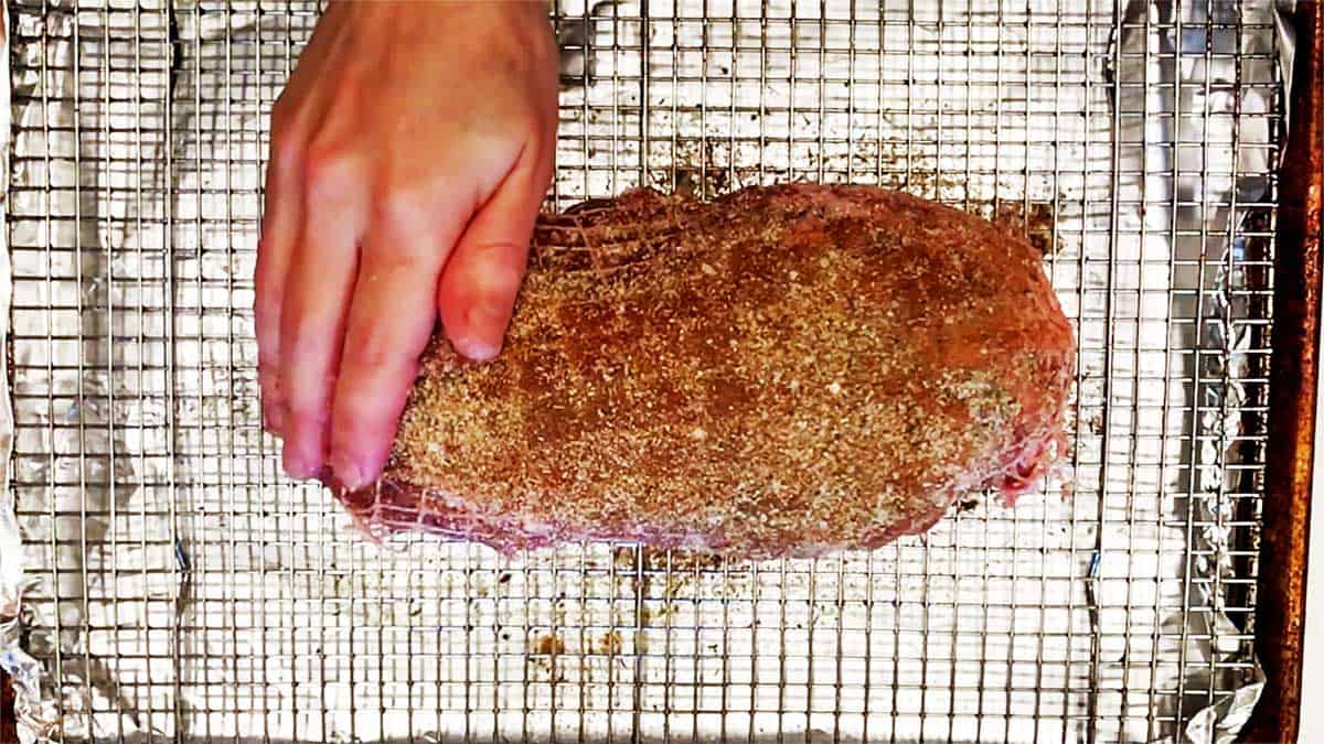 Season the pork with the spices.