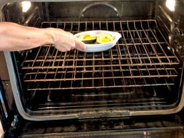 Placing the baking dish in the oven.