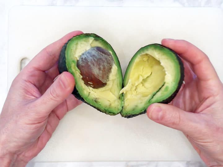 Cutting the avocado.