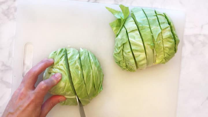 Cutting cabbage into wedges.