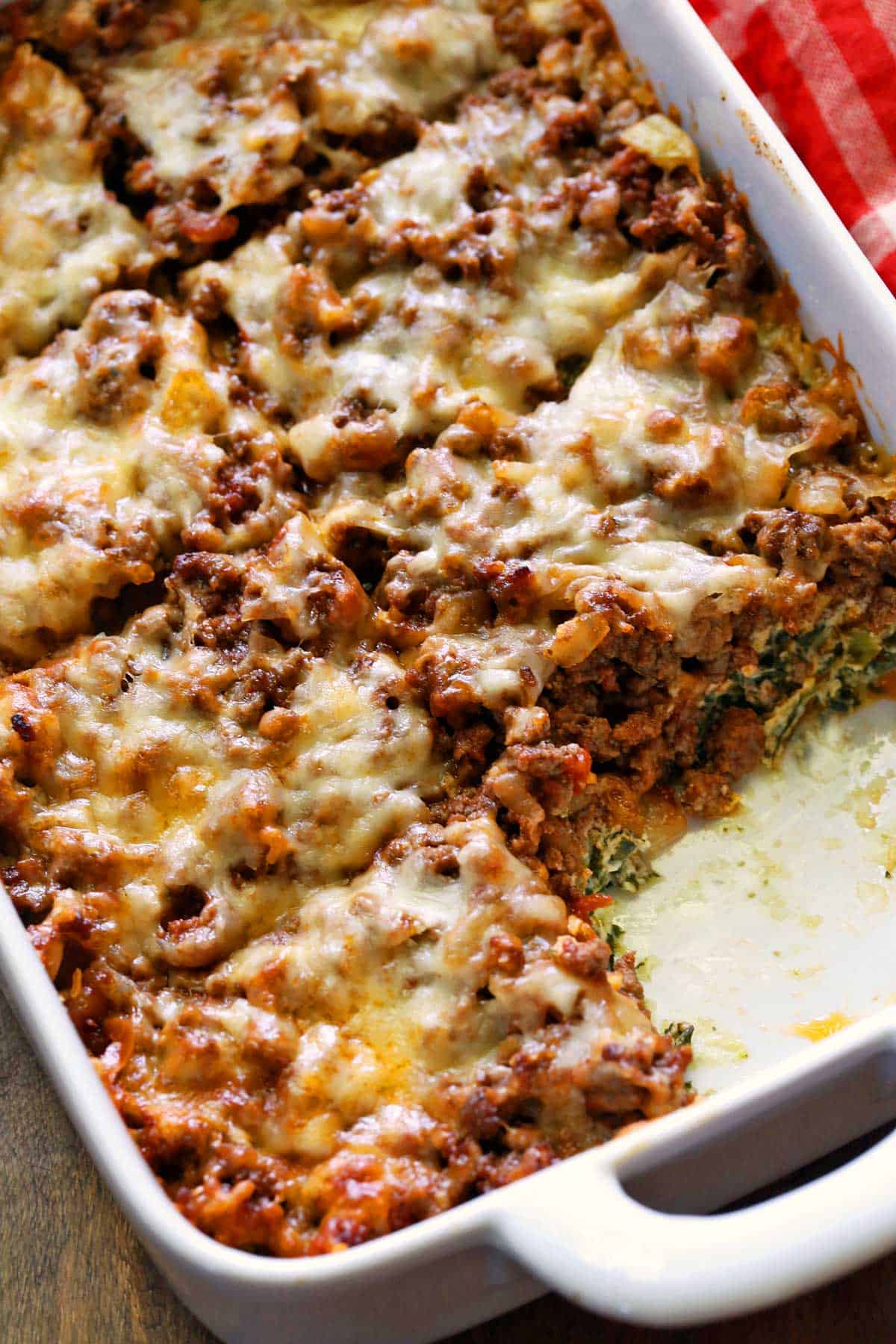 Keto lasagna is served in a white baking dish.