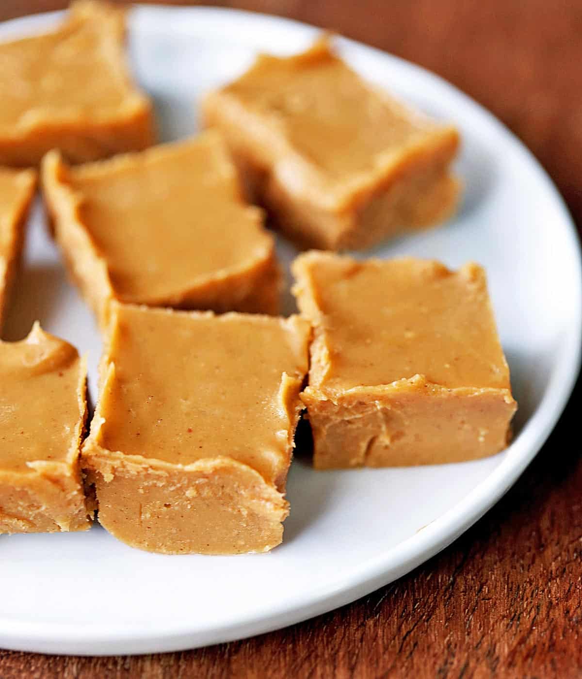 Keto peanut butter fudge is served on a white plate.