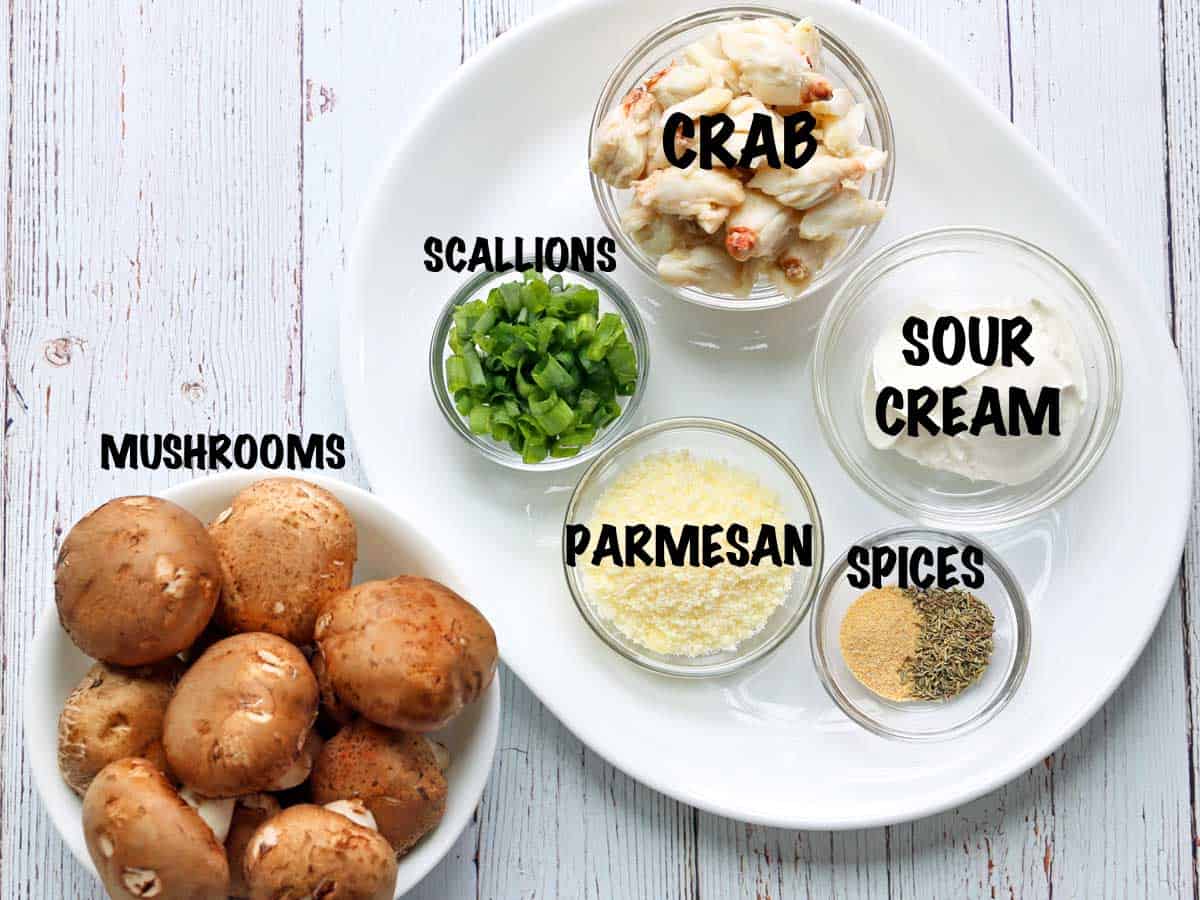 The ingredients needed to make crab stuffed mushrooms.