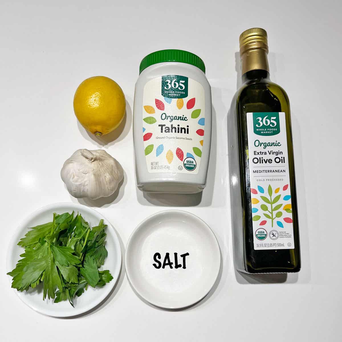 The ingredients needed to make homemade tahini sauce.
