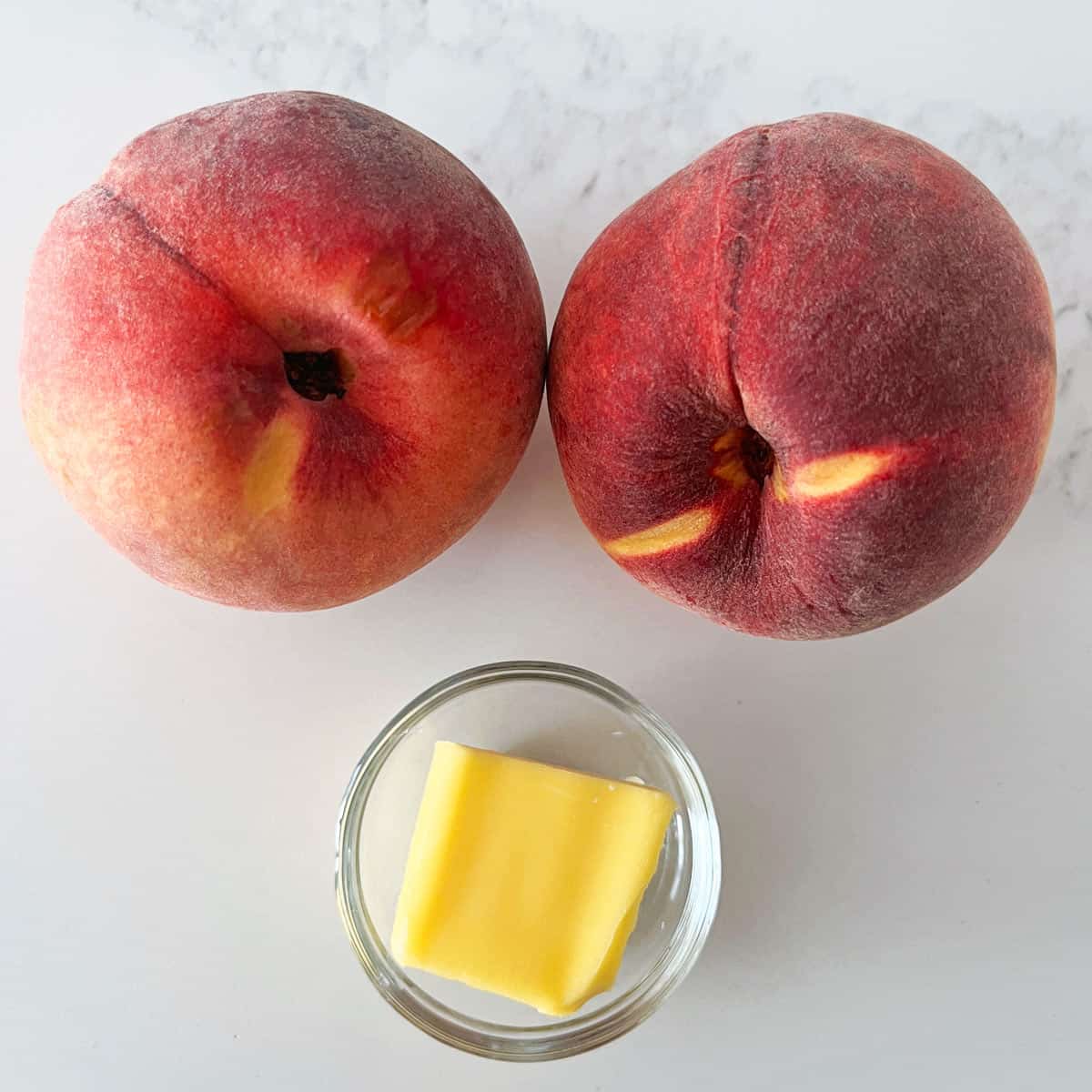 The ingredients needed to cook peaches on the grill.