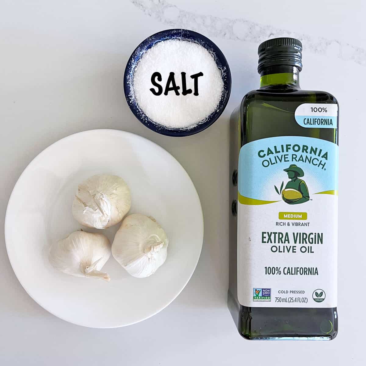 The ingredients needed to make roasted garlic cloves.