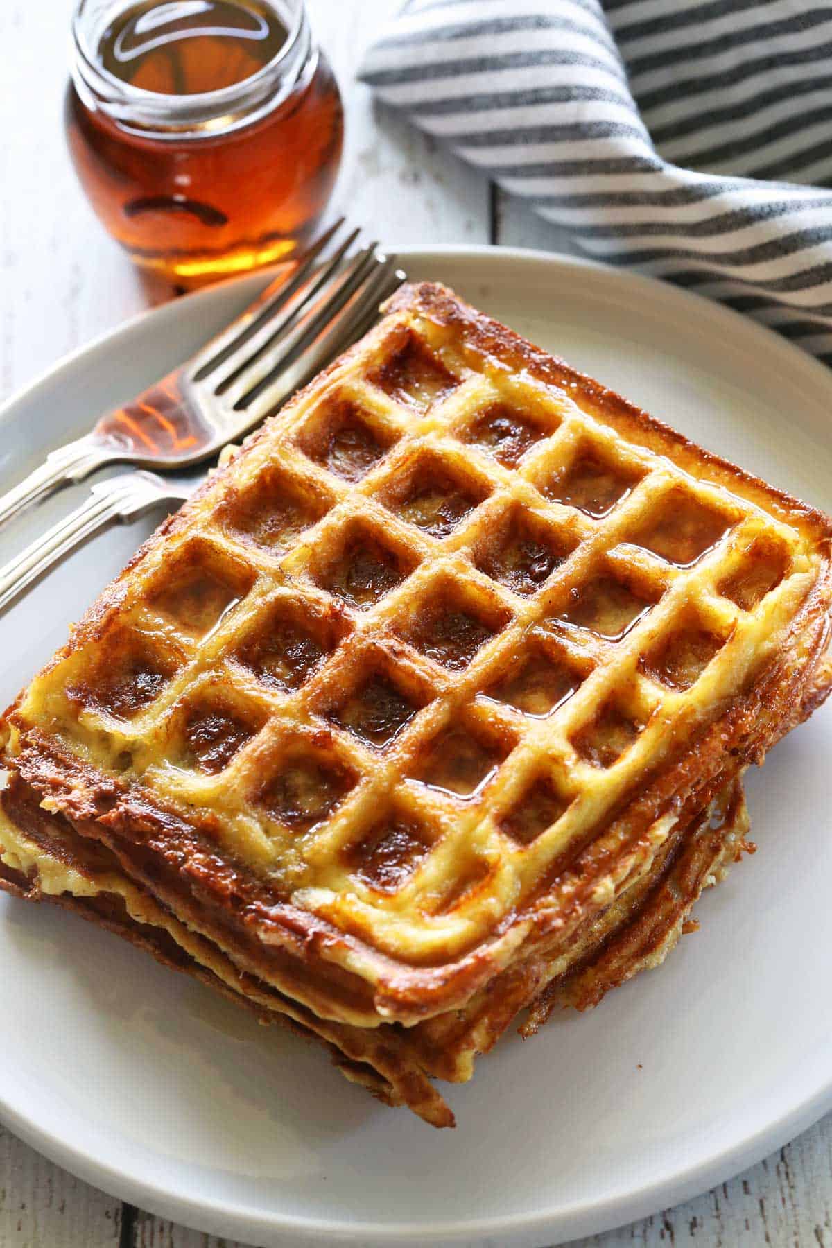 Chaffles are served with forks and sugar-free maple syrup.