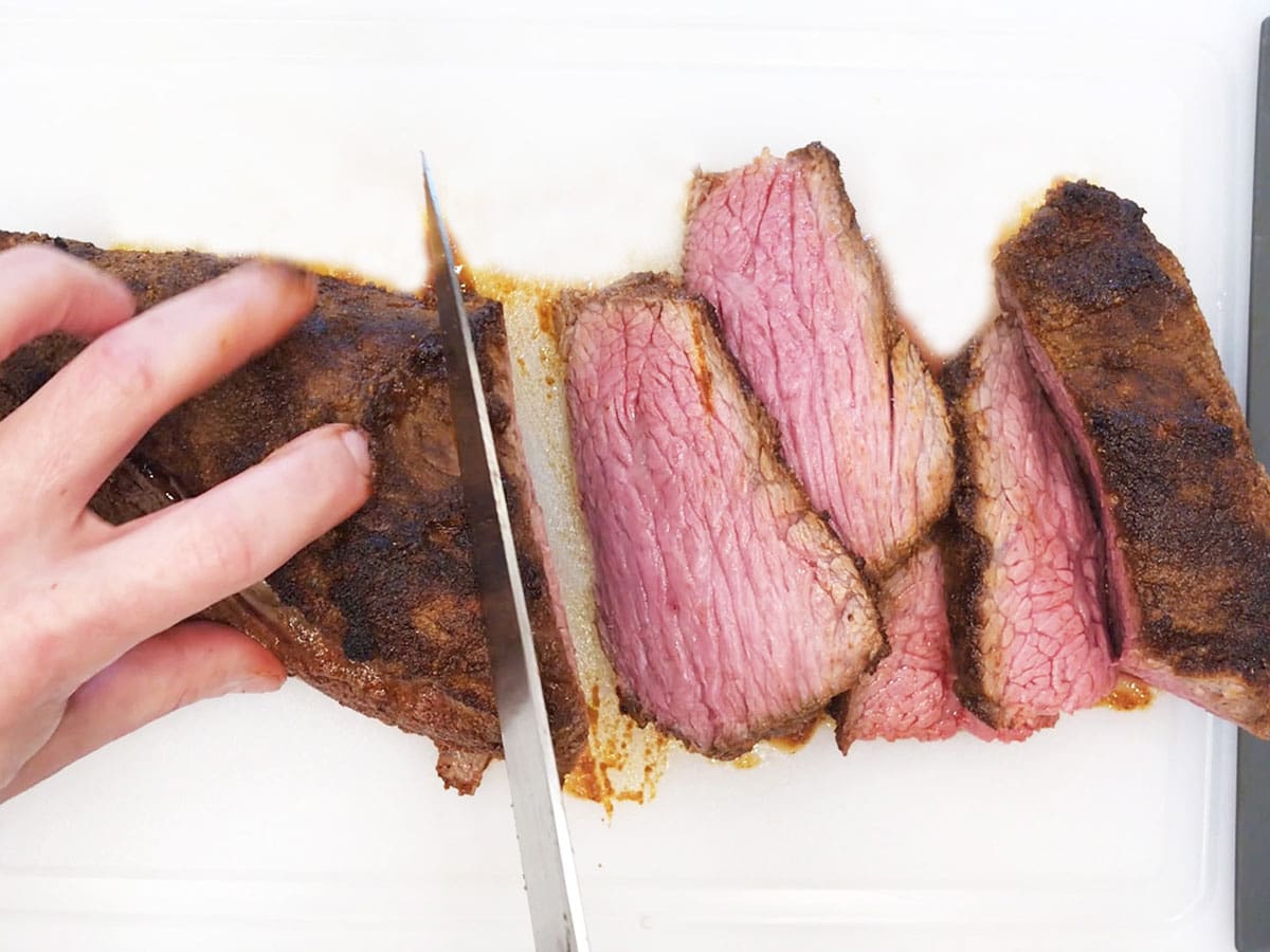 Slicing tri-tip against the grain.