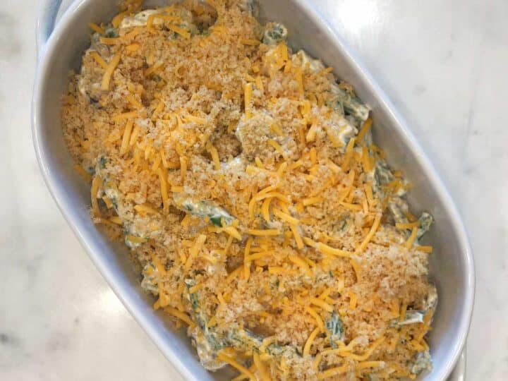 Transferring the mixture to the baking dish.