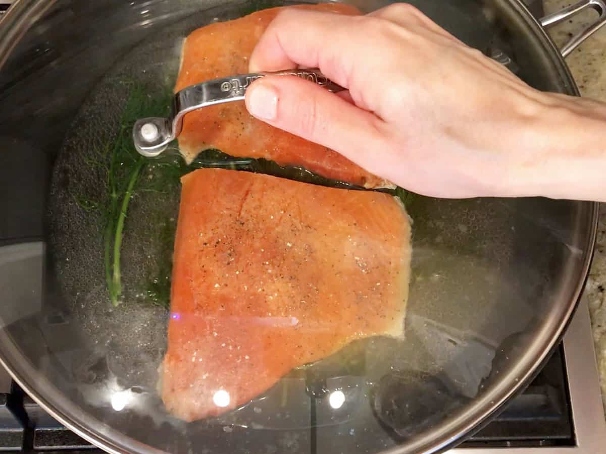 Covering the pan with a lid.