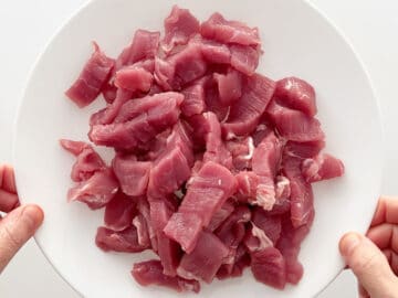 A sliced pork tenderloin on a plate.