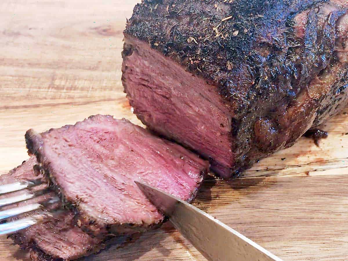 Slicing a ribeye roast.
