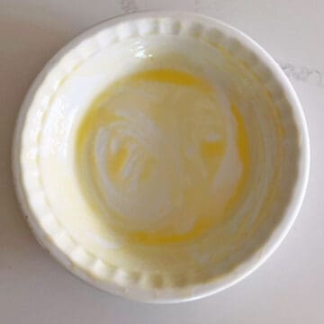 A buttered pie plate.