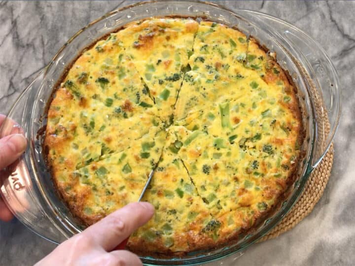 Cutting crustless broccoli quiche.