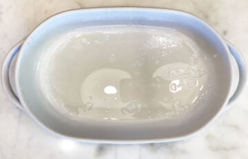 Greased baking dish on the counter.