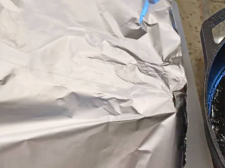 Pork chops covered with foil.