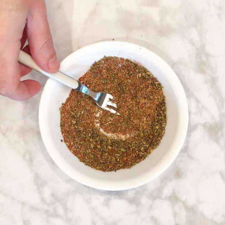 Mixing the spices for roasted pork tenderloin.