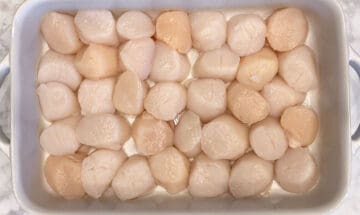 Scallops in a baking dish.