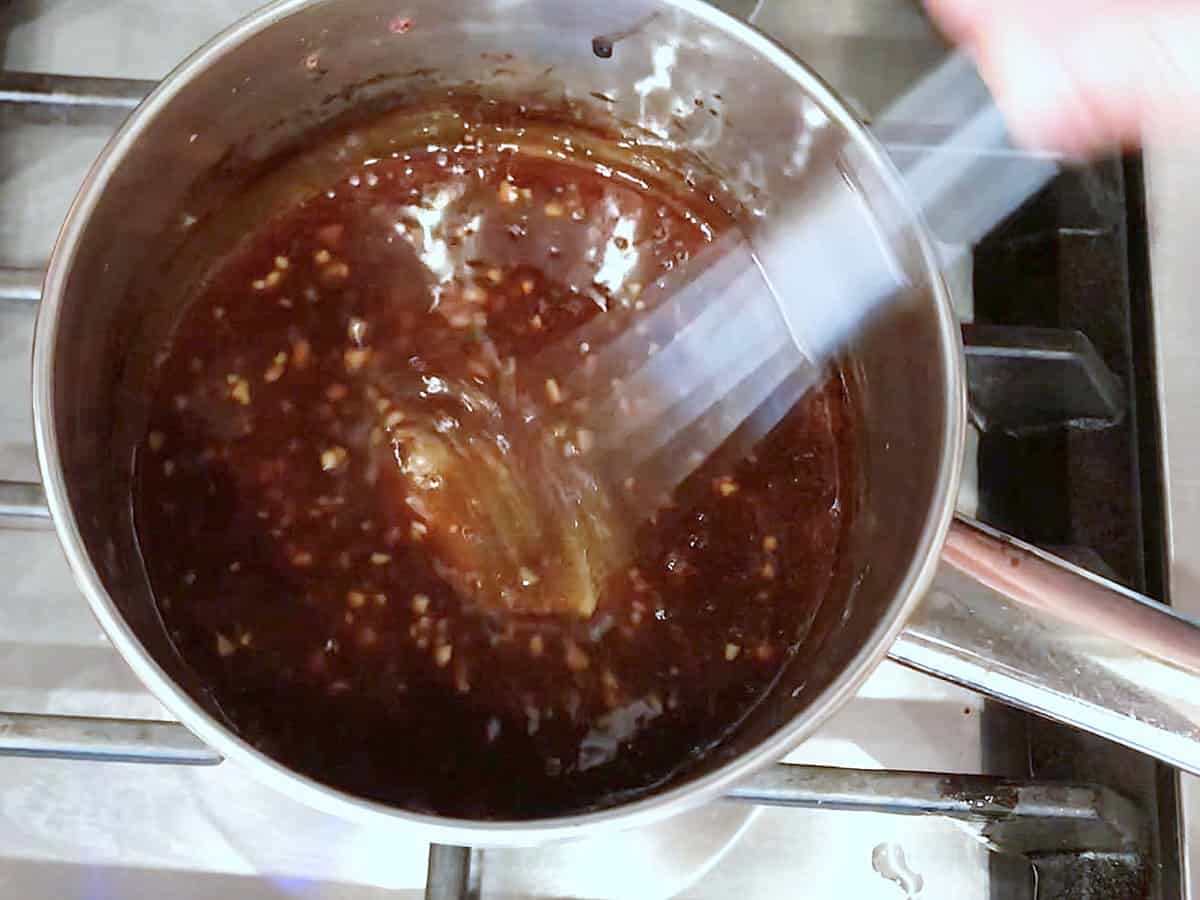 Cooking the glaze in a small saucepan.