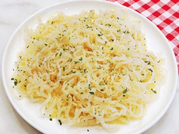 Shirataki noodles are served on a white plate.