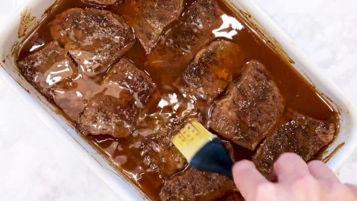 Basting the short ribs.