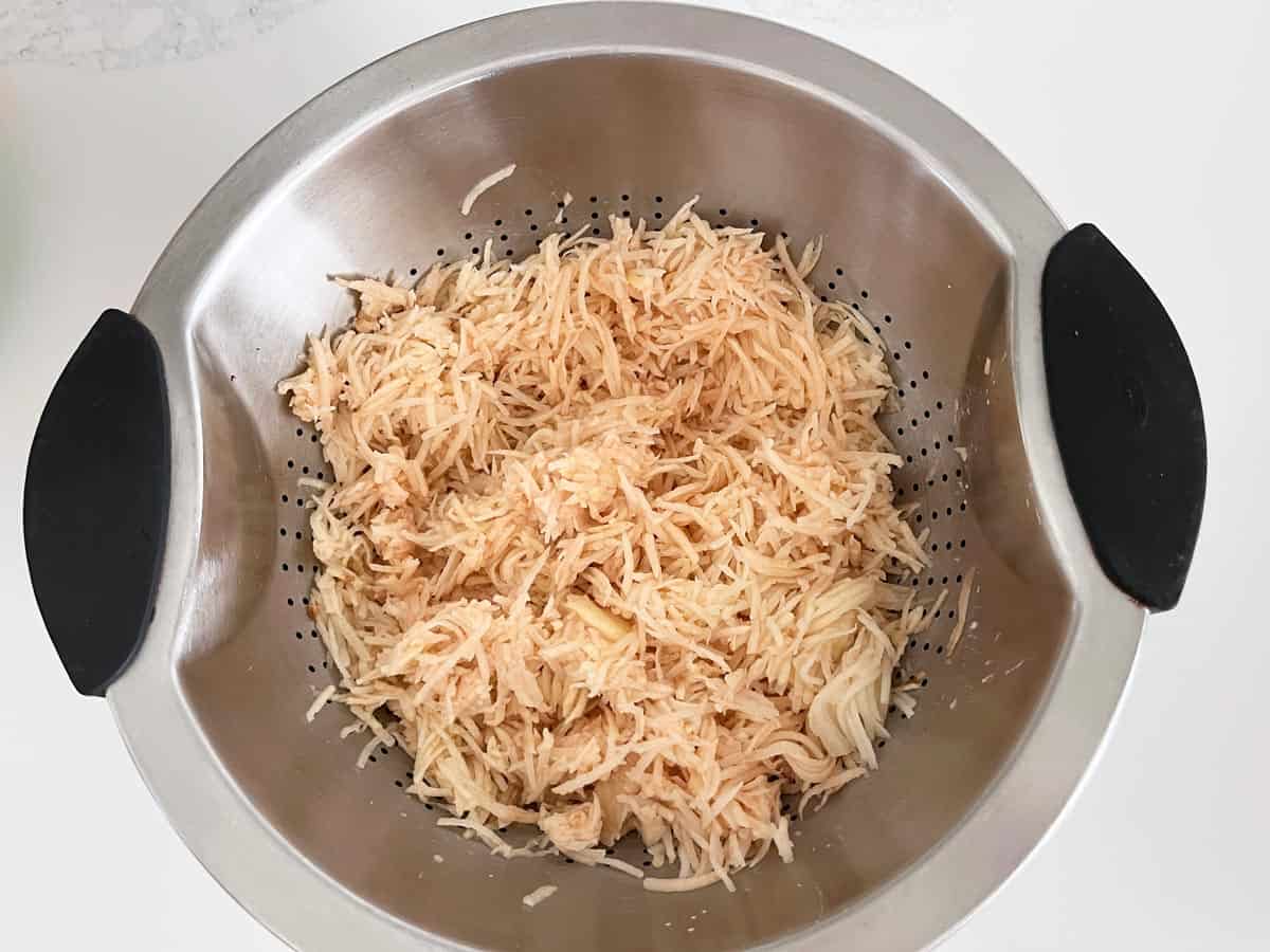 The shredded potatoes become discolored.