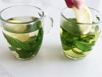 Adding lemon to mint tea.