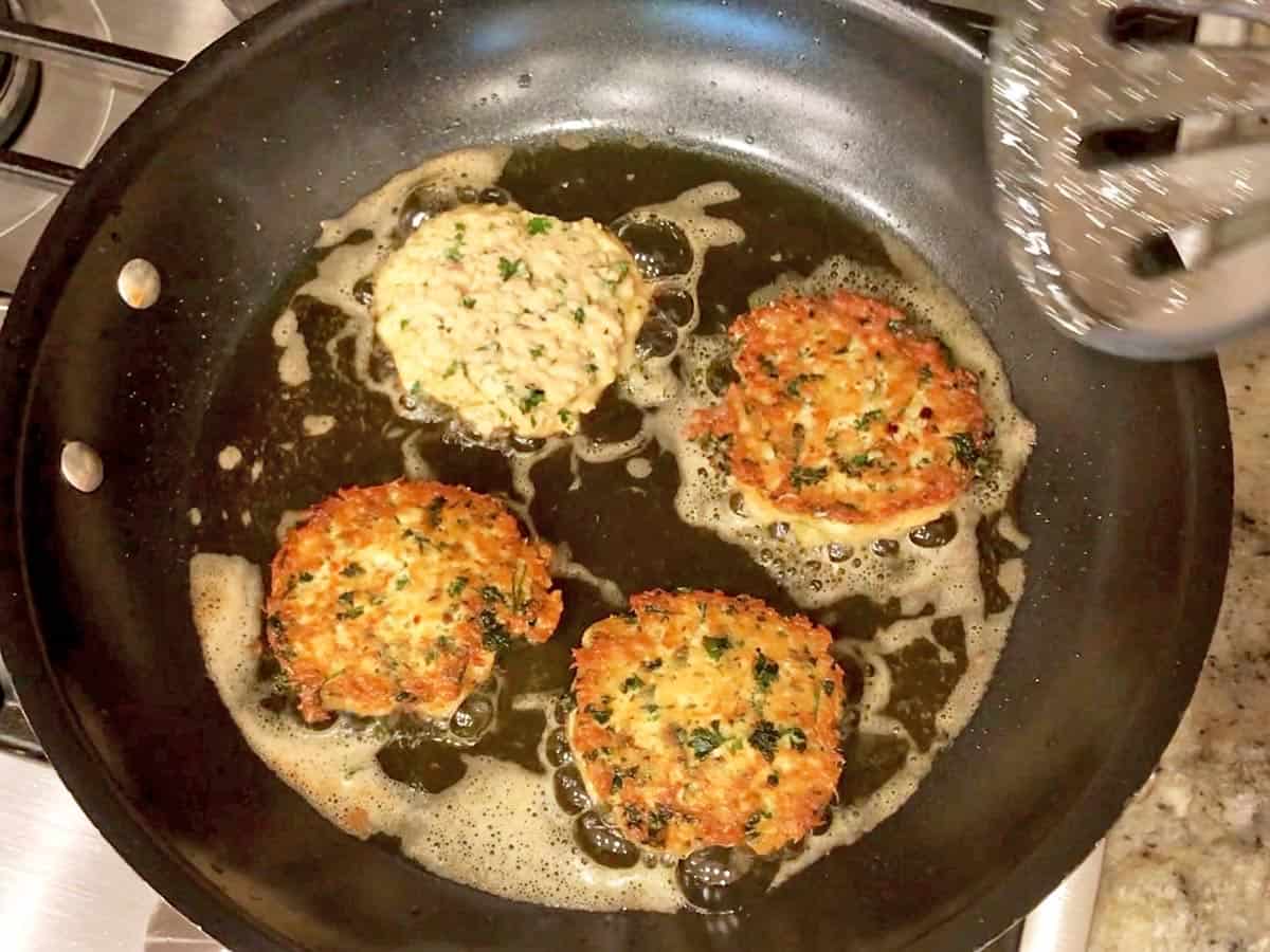 Flipping the patties.