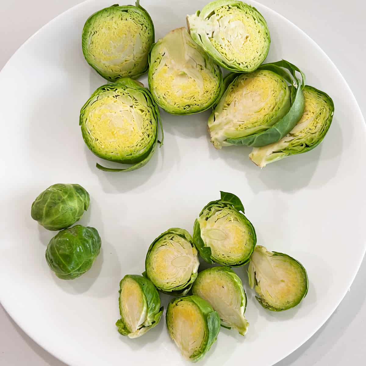 Different sizes of Brussels sprouts, cut.
