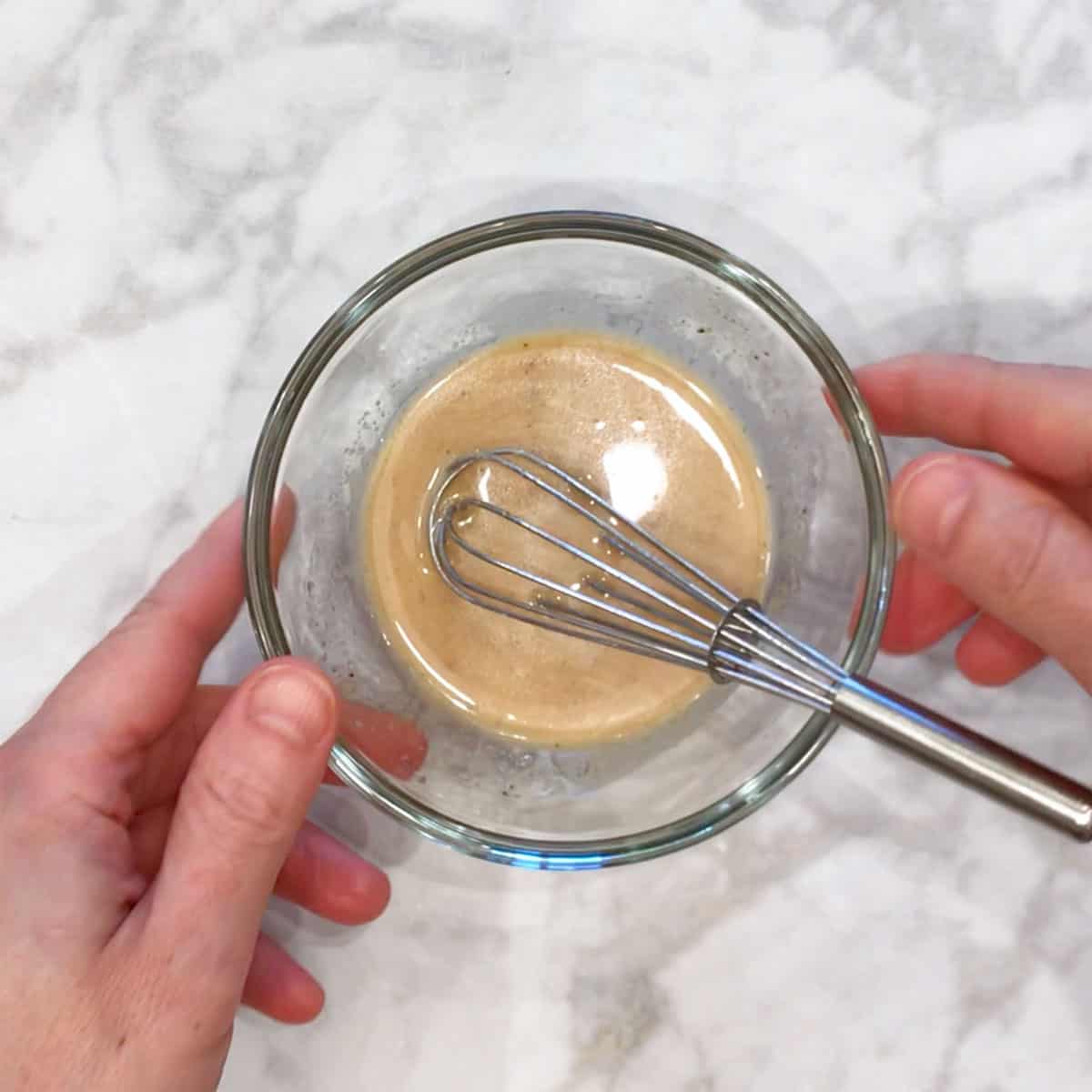 Mixing the salad dressing.