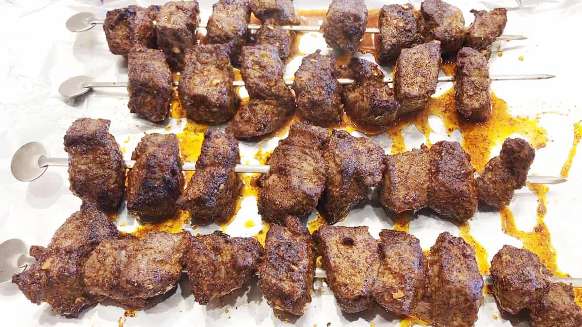 The kabobs are ready in the pan.