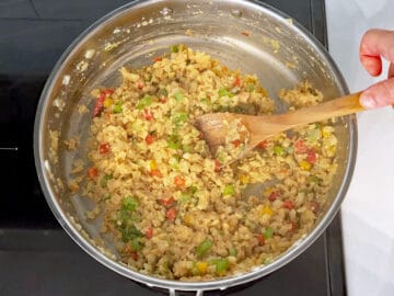 Finishing cooking the cauliflower fried rice.