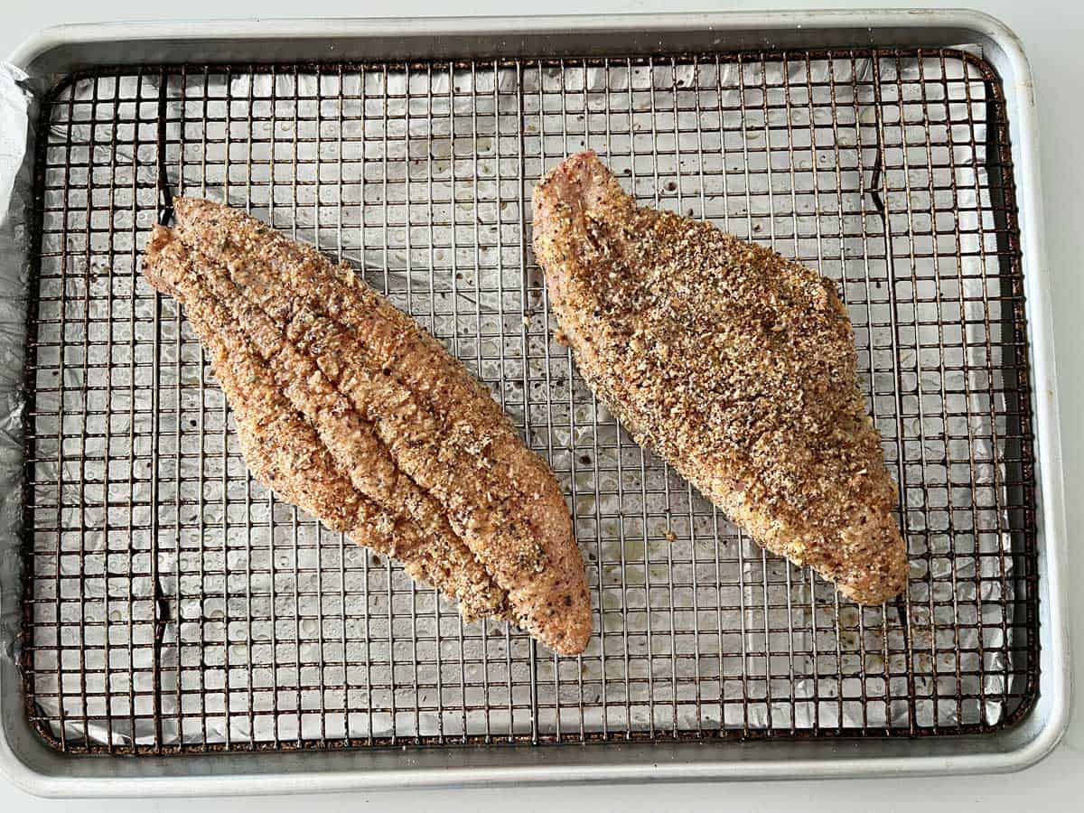 Placing the fish in the pan.