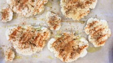 Seasoning the cauliflower.