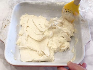 Stirring the mixture again in the pan.