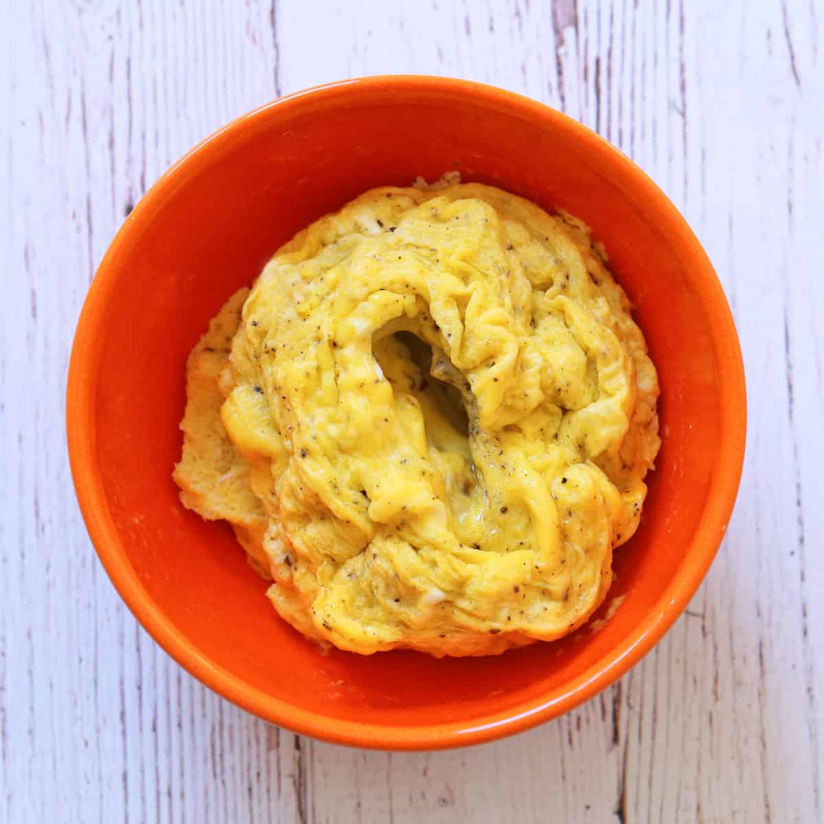 Microwave scrambled eggs with a hole in the middle.