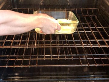 Placing the onions in the oven.