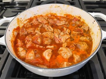 Simmering the stew on the stovetop.