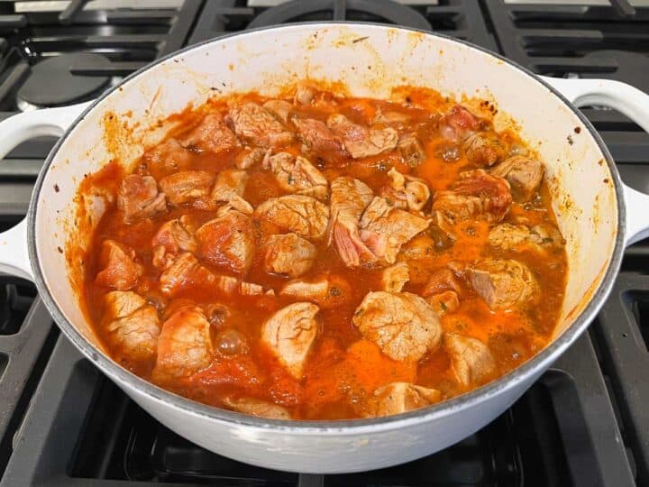 Simmering the stew on the stovetop.