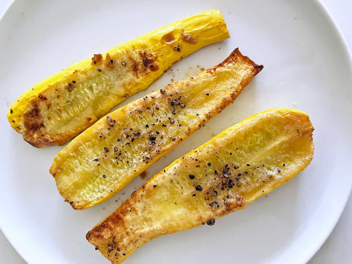 Yellow squash on a white plate. It's not as caramelized as the squash in the other pictures.