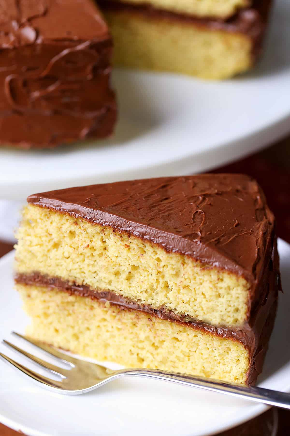 A slice of keto birthday cake is served with a fork.