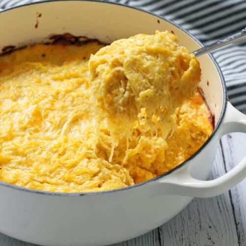 Spaghetti squash casserole is scooped out of the baking dish.